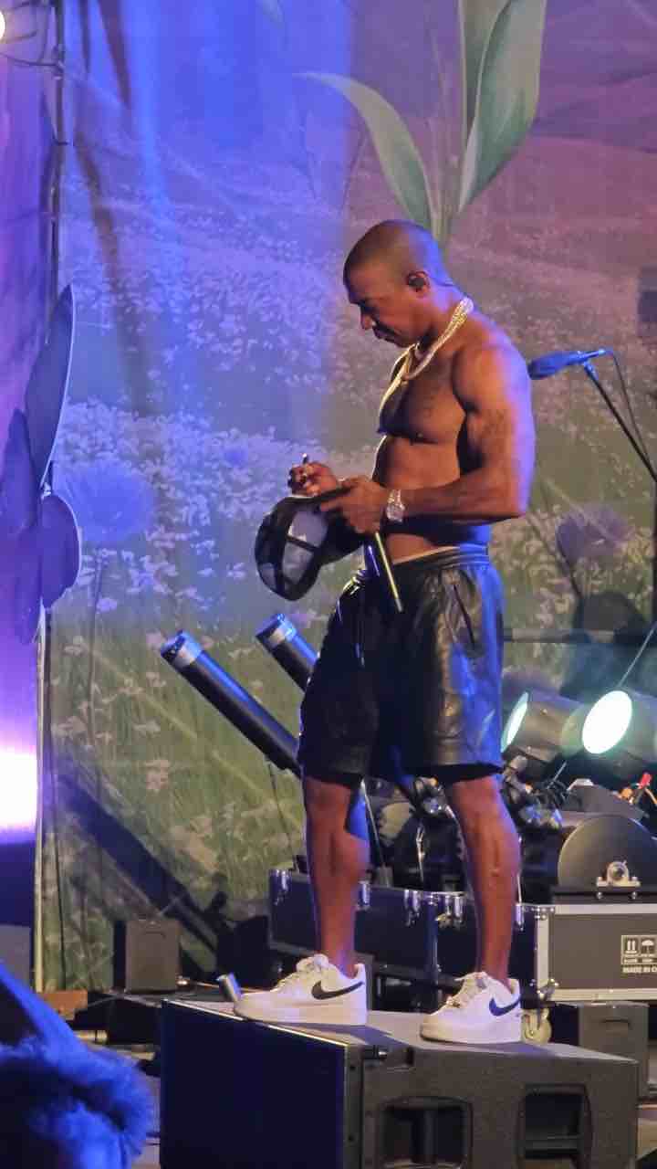 Ja Rule with 6 pack at age of 50 signs hat then gives to fans while performing on Trinidad island
